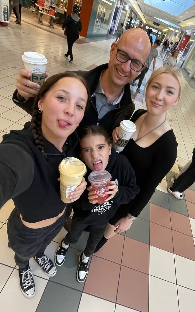 Markus and his daughters selfie drinking Starbucks at the Mall